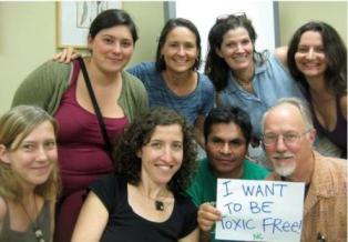 Group holding toxic free sign
